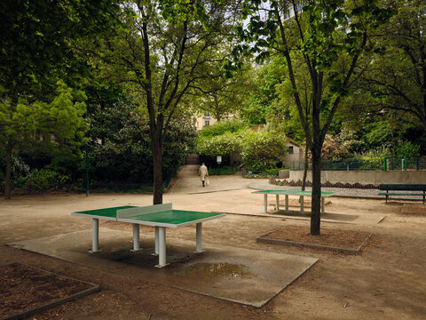 Empty ping pong tables waiting in tranquil city park