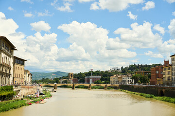 Fototapeta premium Ponte Santa Trinita over a murky river in florence italy