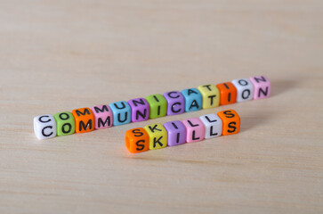 Communication Skills Concept with Beads on Wooden Surface – Emphasizing Soft Skills in Modern...