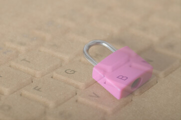 Cybersecurity Visualized: Pink Lock on Computer Keyboard