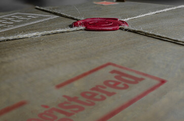 Sealed parcel with wax stamp and custom label