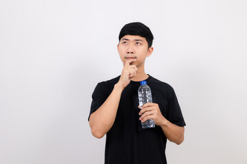 Positive asian man black shirt hold water bottle gesture thinking isolated