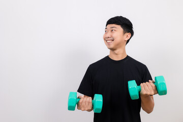 Positive asian man happy smile black shirt work out with dumbbell smile and look at space isolated