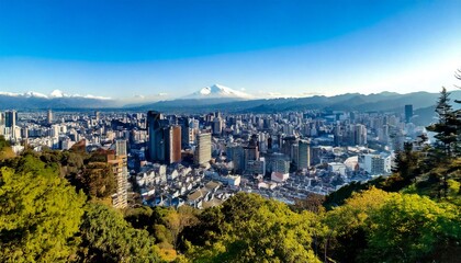 Fototapeta premium Iconic urban skyline framed by green hills and snowy peaks 