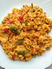 Cooked Pasta with mixed vegetables. Pasta made from an unleavened dough, typically of wheat flour and water, Asian Food cooked like noodles. Closed view.