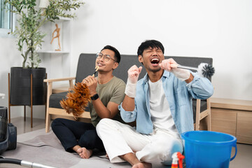 LGBTQIA Partners Singing While Cleaning Their Home
