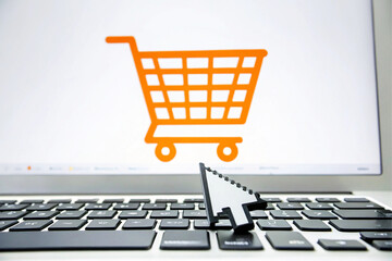 Orange Shopping Cart Icon on Laptop Screen with Cursor Clicking