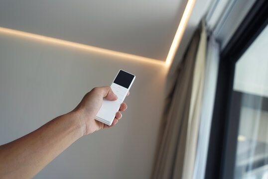 Worker checking Automatic curtain control system in apartments