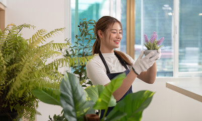 Indoor Gardening Joy. Young woman caring for potted plants with a smile.