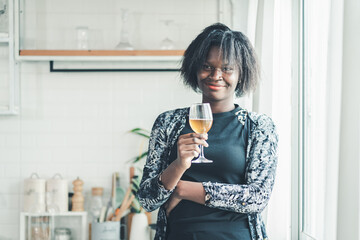 Business, working, technology, Black woman freelancer smiling while using laptop at home, relaxed...