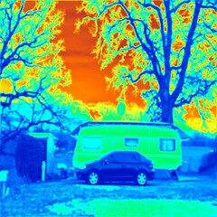 Camping at lake. Car with tent and caravan. Thermal photography