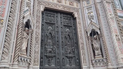 Florence Cathedral Exterior. This footage captures the majestic entrance and decorative elements. A perfect resource for architectural enthusiasts and art history projects.