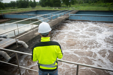 A wastewater treatment engineer is inspecting the operation of a water treatment plant