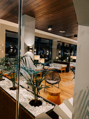 Modern lounge area with stylish decor in a contemporary hotel setting during evening hours