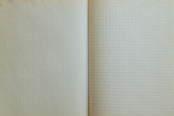 Notebook in a cage old fastened with staples, educational background for school and education
