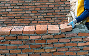 Close up of bricklayer building walls