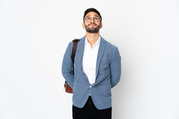 Young caucasian business man isolated on white background and looking up