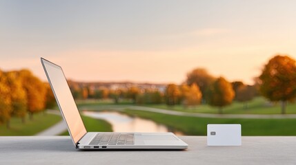 Silver Laptop on a Stone Surface with Autumnal Park Background
