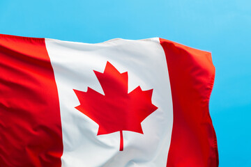 Canada flag waving on blue background