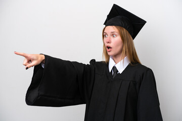 Young university graduate English woman isolated on white background pointing away