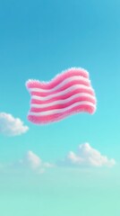 Pink and White Striped Fluffy Flag Floating in a Blue Sky