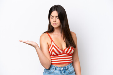 Fototapeta premium Young Brazilian woman isolated on white background holding copyspace with doubts