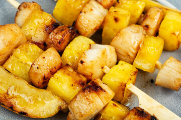 Grilled scallops with pineapple.
