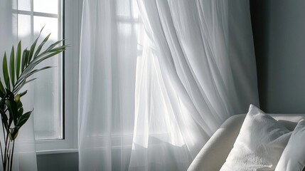 Bedroom with a large window on the left side. the window is covered with white sheer curtains that are open, allowing natural light to enter the room.