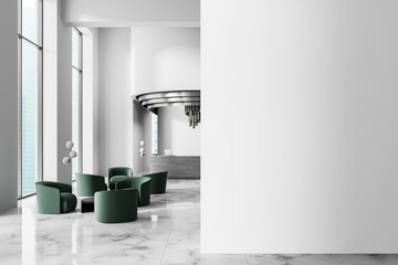 Modern office lobby with green chairs and large blank wall for poster mockup presentation in clean...