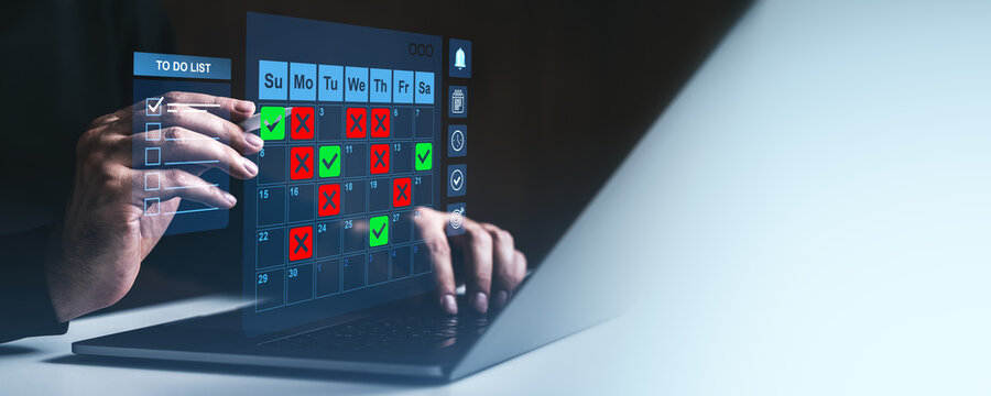 Futuristic digital calendar and to-do list interface displayed on transparent screen over laptop for task management concept visualization.