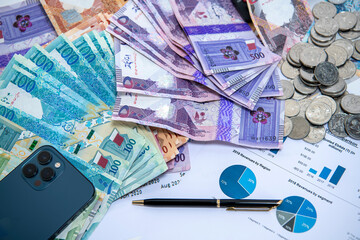 Doha, Qatar - June 07, 2025: Qatar Currency Bank Notes. Qatari Riyal ,Notes,500,200,100,50,10,5,1 on isolated background. Business and Finance Concept