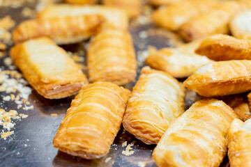 A deliciously crispy golden taro cake freshly fried and served at a bustling night market. The...