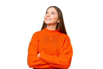 Young blonde woman over isolated chroma key background looking up while smiling