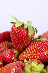 Fresh strawberries piled up. Summer harvest of organic berries.