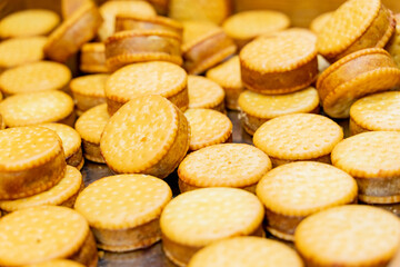 A deliciously crispy golden taro cake freshly fried and served at a bustling night market. The snack features a crunchy exterior with a soft, flavorful taro filling, capturing the authentic taste of t