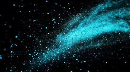 Vibrant blue particles explosion on black background