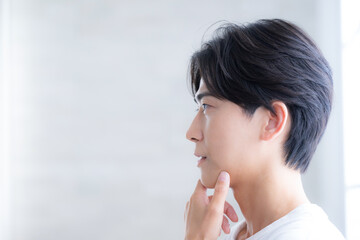 Young handsome man beauty and beauty transparency, fresh skin care image Camera eye thinking with...