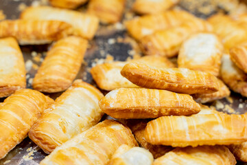 A deliciously crispy golden taro cake freshly fried and served at a bustling night market. The...