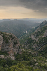 Montserrat mountain range in Spain near Barcelona in the Catalan Mountains. Mountain landscape with valley in the background. Vertical view