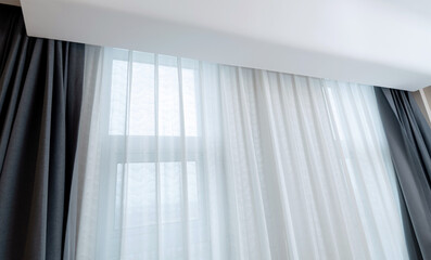 Room window with white curtain