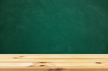 Empty wooden table with copy space on school table with board in background