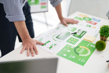 Adult Caucasian Male Hands Reviewing Green Business ESG Report for Environmental Governance and...