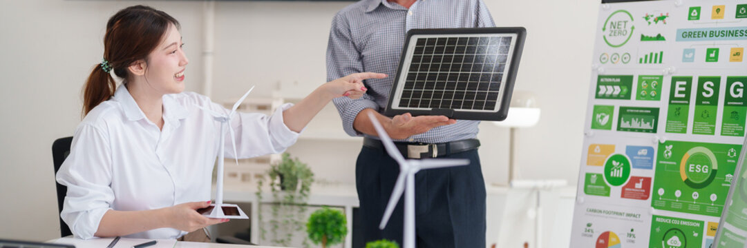 Diverse professionals collaborate on ESG green business strategies for renewable energy carbon dioxide emission reduction targets - Powered by Adobe