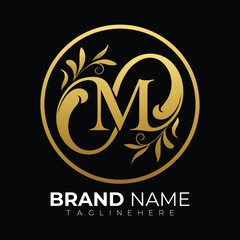 Elegant gold letter M monogram with floral accents in circle