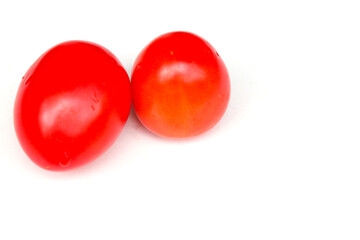 Ripe red tomatoes on white background