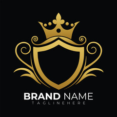 Elegant gold shield crest with crown and flourishes on black background