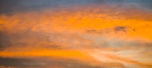 The sky and clouds are orange in the evening.