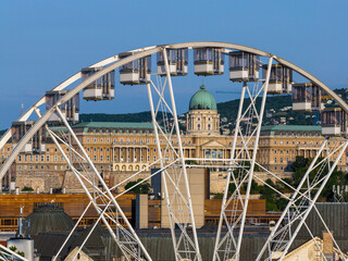 The Giant ferris wheel is framing the Buda royal castle. Hungarian name is Budai var.
