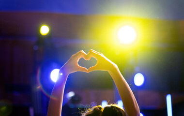 Heart shaped hands at the concert