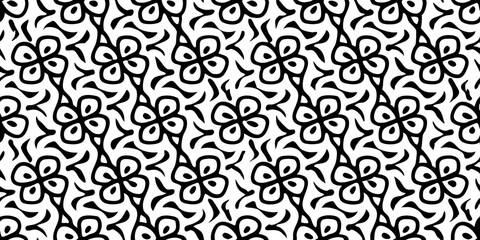 Black and White Floral Pattern: An abstract, rhythmic display of intertwined floral patterns, rendered in a bold contrast of black and white, creating a captivating visual texture.